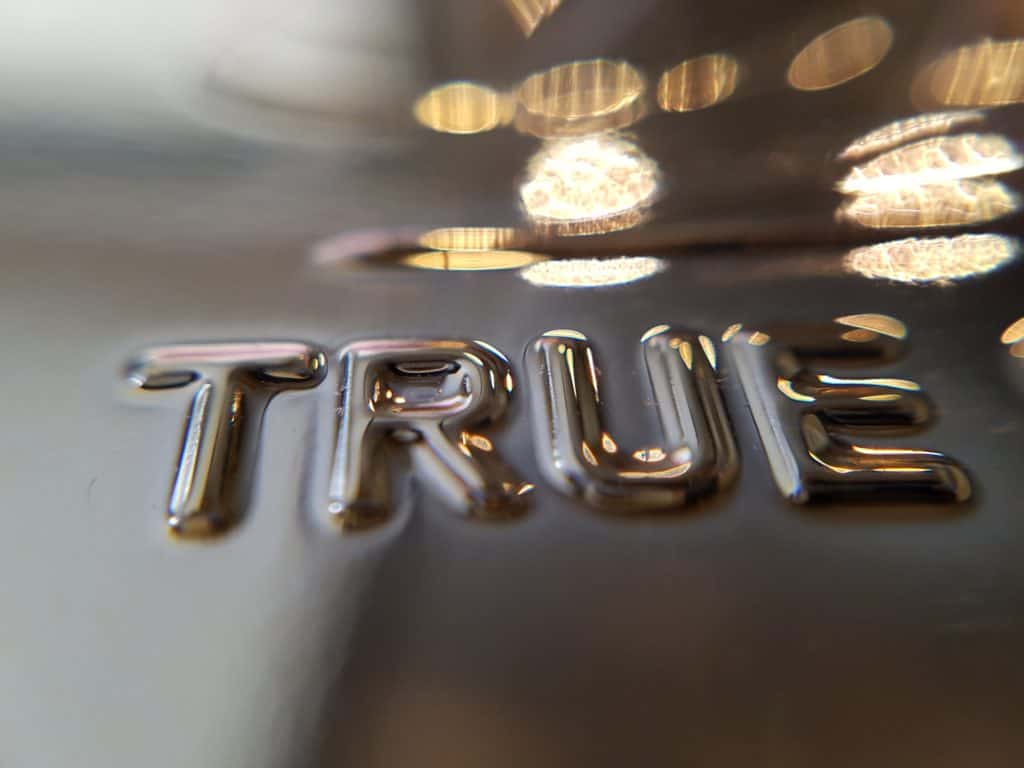 A photo of the word True embossed.