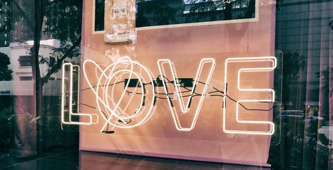 An image of a neon sign that says love.