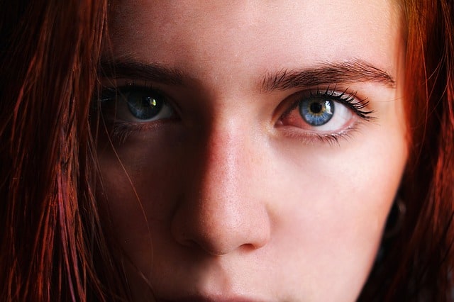An Image of a woman's beautiful blue eyes glaring.